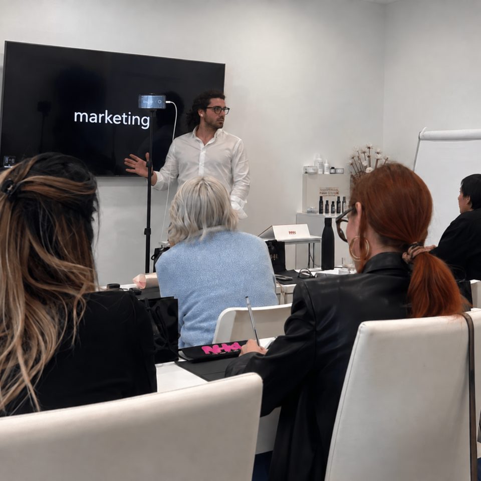 Mattia Ludovico presenting a marketing workshop to a seated audience